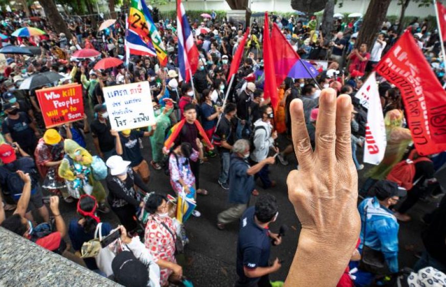 Pro-democracy protesters salute with a three-finger symbol of resistance during a protest  during a protest in Bangkok, Thailand, Saturday, Sept. 19, 2020. Protesters gathered Saturday in Bangkok for the most ambitious rally so far in a pro-democracy campaign that has shaken up the government and the country's conservative establishment. (AP Photo/Wason Wanichakorn)