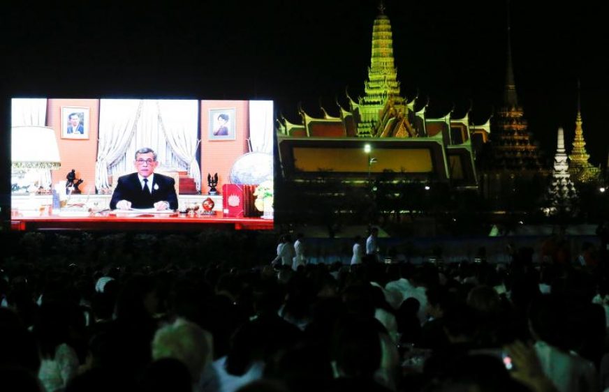 Thailand's new King Maha Vajiralongkorn Bodindradebayavarangkun is seen on a screen as he delivers a speech to Thais to celebrate new year at the Sanam Luang park, Bangkok, Thailand December 31, 2016. REUTERS/Chaiwat Subprasom