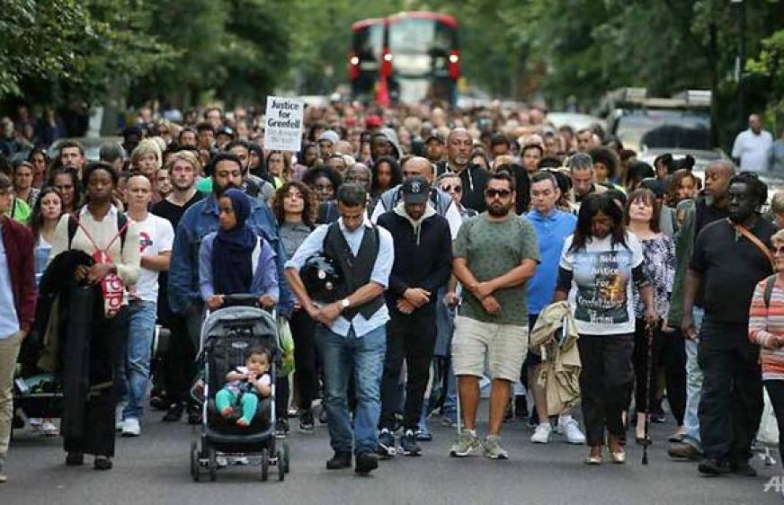 20170815-vod-udom-g-gg-Hundreds join silent London march for fire victims