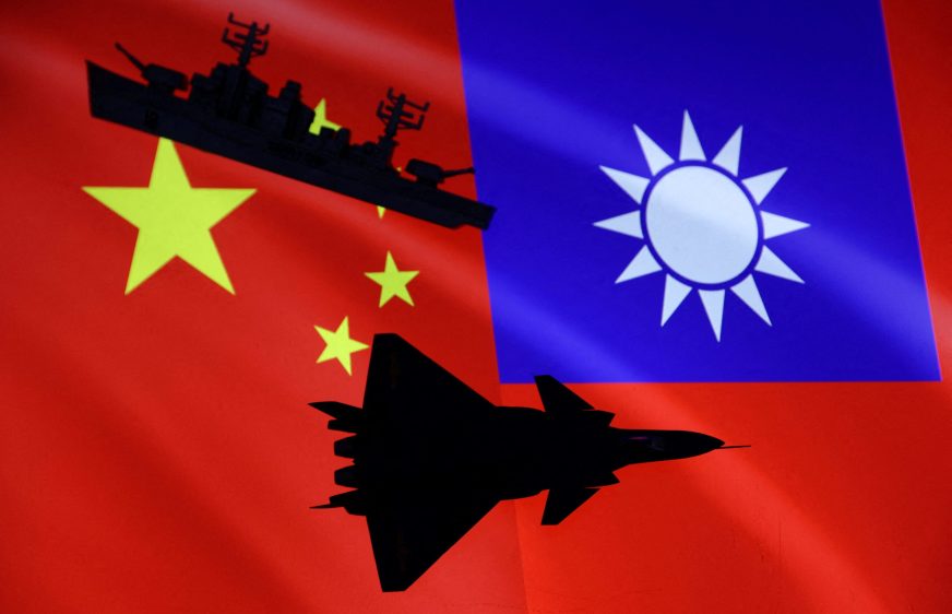 FILE PHOTO: Aircraft carriers and airplane are seen in front of Chinese and Taiwanese flags in this illustration, August 6, 2022. REUTERS/Dado Ruvic/Illustration/File Photo