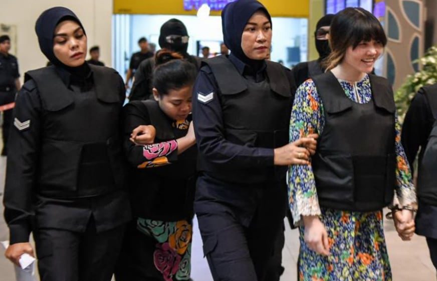 Vietnamese defendant Doan Thi Huong (right) and Indonesian defendant Siti Aishah (second from left) are escorted by Malaysian police personnel at the low-cost carrier Kuala Lumpur International Airport 2 in Sepang, on Oct 24, 2017.PHOTO: AFP
